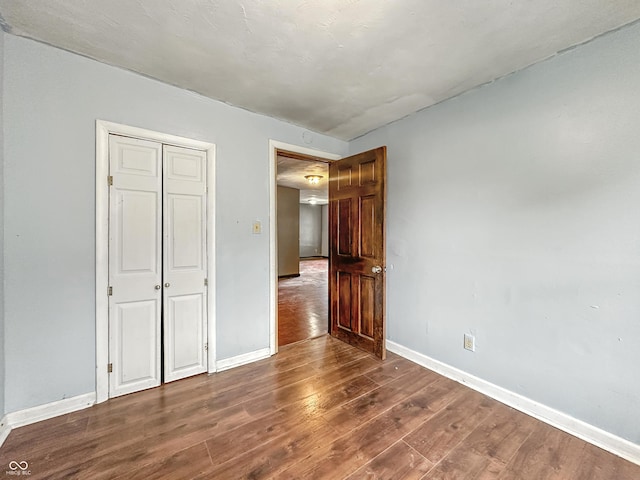 356 S 7th St, Frankfort, IN 46041 - unfurnished bedroom featuring wood finished floors and a closet