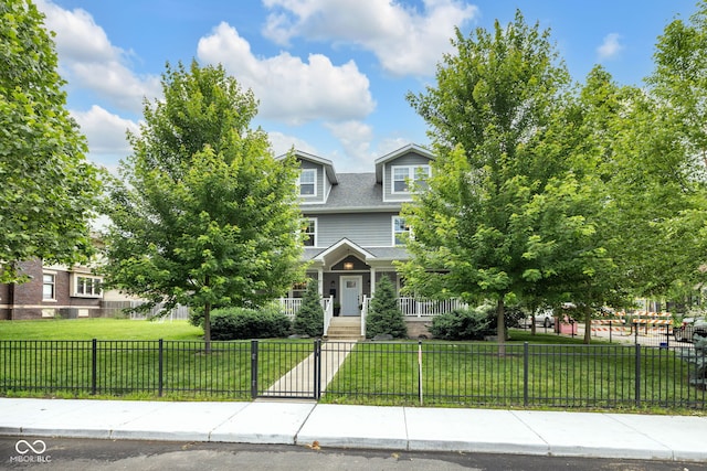 3101 N Washington Blvd, Indianapolis, IN 46205 - view of property hidden behind natural elements with a fenced front yard and roof with shingles