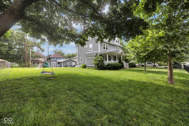 3101 N Washington Blvd, Indianapolis, IN 46205 - view of grassy yard featuring a playground and a porch