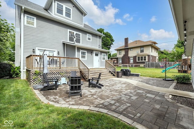 3101 N Washington Blvd, Indianapolis, IN 46205 - rear view of house featuring a patio, a deck, a playground, and a shingled roof