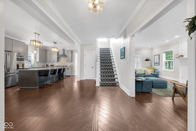 3101 N Washington Blvd, Indianapolis, IN 46205 - living area with stairs, crown molding, and dark wood-style flooring