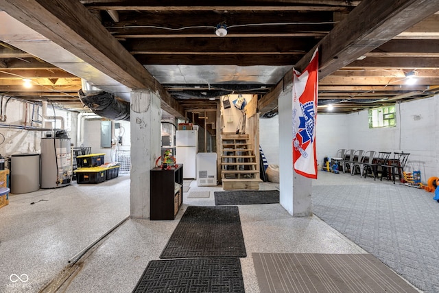 3101 N Washington Blvd, Indianapolis, IN 46205 - below grade area featuring water heater, freestanding refrigerator, stairway, and electric panel