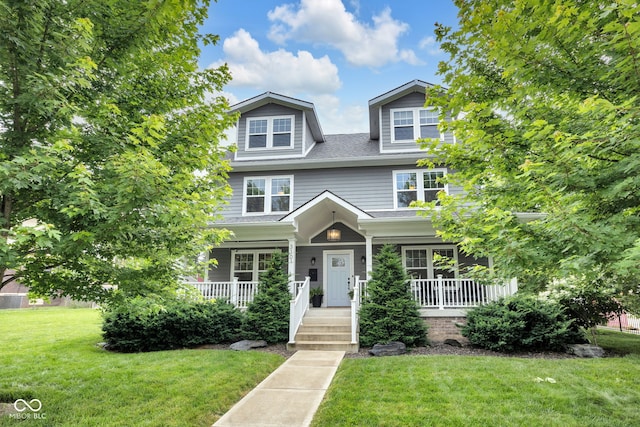 3101 N Washington Blvd, Indianapolis, IN 46205 - view of front of home featuring a porch, a front yard, and roof with shingles
