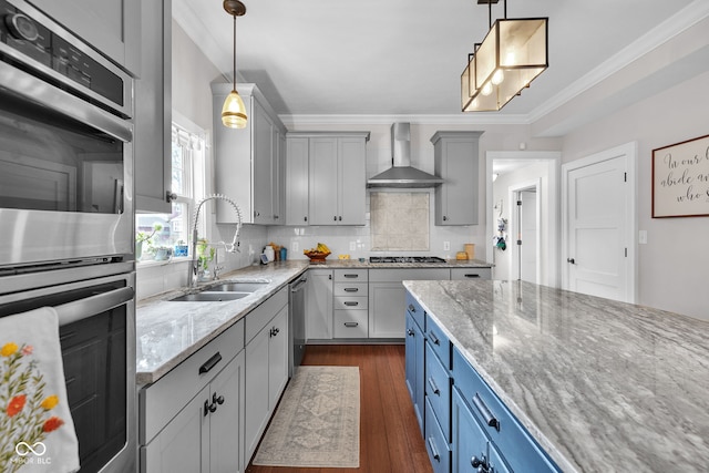 3101 N Washington Blvd, Indianapolis, IN 46205 - kitchen with wall chimney exhaust hood, appliances with stainless steel finishes, light stone counters, dark wood-style flooring, and decorative backsplash
