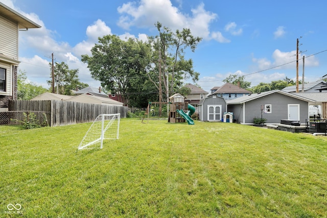 3101 N Washington Blvd, Indianapolis, IN 46205 - fenced backyard with a storage shed and a playground