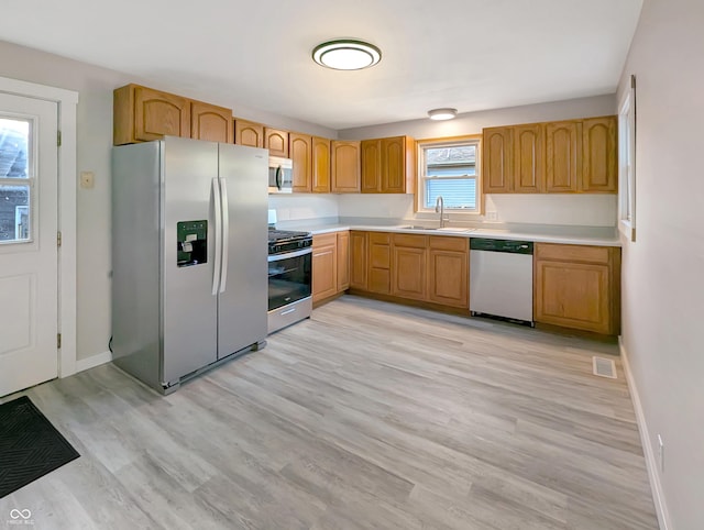 29 N State Road 29, Michigantown, IN 46057 - kitchen with appliances with stainless steel finishes, light countertops, and light wood finished floors