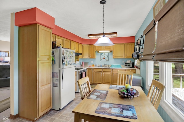 2777 S 600 E, Franklin, IN 46131 - kitchen with white appliances, light countertops, under cabinet range hood, pendant lighting, and light brown cabinetry