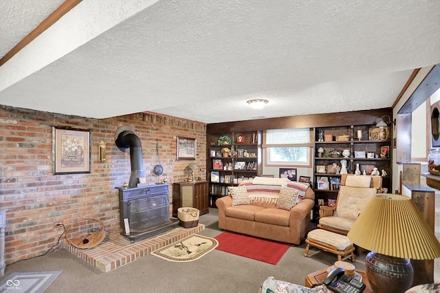2777 S 600 E, Franklin, IN 46131 - carpeted living area featuring a textured ceiling, a wood stove, and brick wall