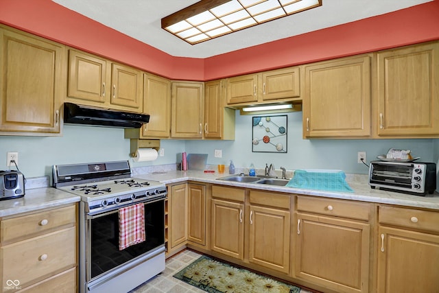 2777 S 600 E, Franklin, IN 46131 - kitchen with white gas stove, under cabinet range hood, light brown cabinetry, and light countertops