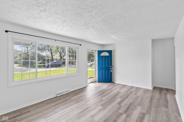 2829 Dakota Dr, Anderson, IN 46012 - foyer with wood finished floors and a textured ceiling