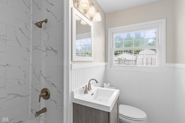 2829 Dakota Dr, Anderson, IN 46012 - full bathroom featuring a wainscoted wall, vanity, and a marble finish shower