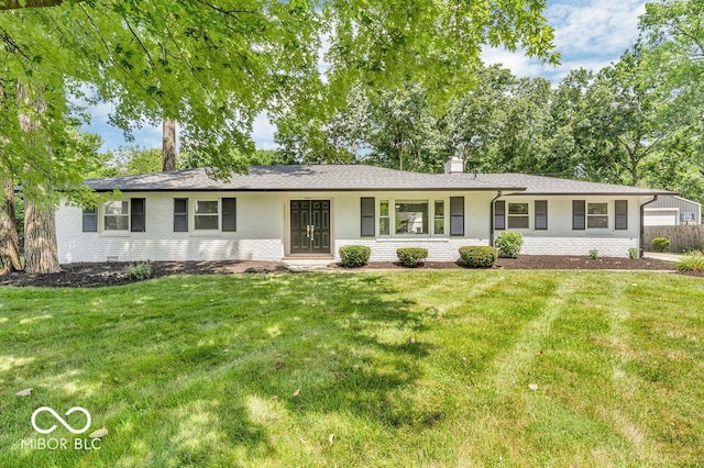 9639 Maple Dr, Carmel, IN 46280 - single story home featuring brick siding, a chimney, and a front yard