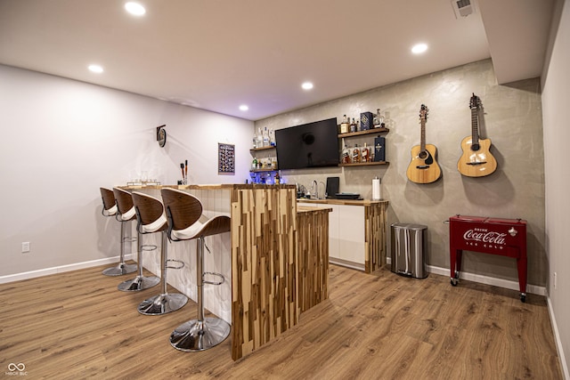 14404 Stairbridge Pl, Carmel, IN 46074 - indoor wet bar with light wood finished floors and recessed lighting
