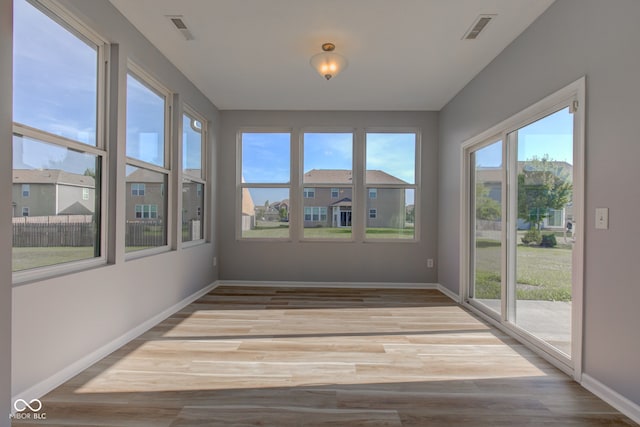 14620 Hinton Dr, Fishers, IN 46037 - unfurnished sunroom with baseboards and wood finished floors