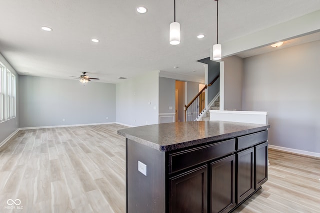 14620 Hinton Dr, Fishers, IN 46037 - kitchen featuring a ceiling fan, light wood-style flooring, recessed lighting, hanging light fixtures, and dark countertops