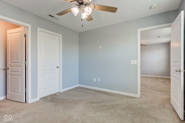 14620 Hinton Dr, Fishers, IN 46037 - unfurnished bedroom with light colored carpet and ceiling fan