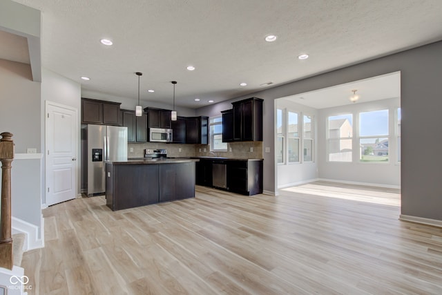 14620 Hinton Dr, Fishers, IN 46037 - kitchen featuring stainless steel appliances, light wood-style floors, recessed lighting, open floor plan, and a kitchen island