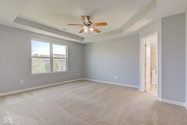 14620 Hinton Dr, Fishers, IN 46037 - unfurnished room featuring a raised ceiling, ceiling fan, and light colored carpet