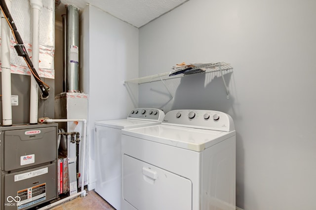 14620 Hinton Dr, Fishers, IN 46037 - laundry room with washing machine and dryer and heating unit
