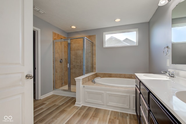 14620 Hinton Dr, Fishers, IN 46037 - full bathroom with a bath, a shower stall, double vanity, and wood finished floors