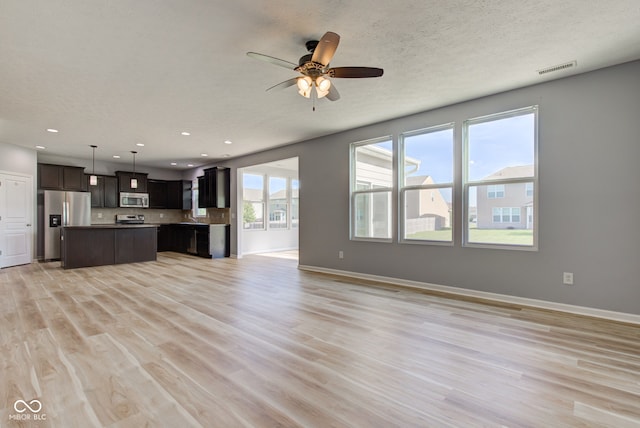 14620 Hinton Dr, Fishers, IN 46037 - unfurnished living room with ceiling fan, light wood-type flooring, and recessed lighting