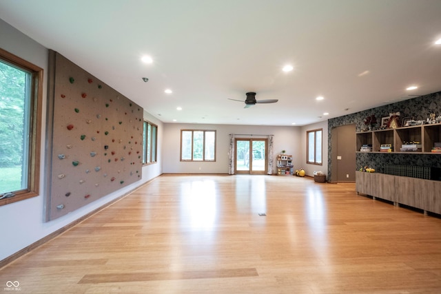 3711 Tara Ct, Carmel, IN 46074 - unfurnished living room with wallpapered walls, an accent wall, ceiling fan, light wood-style flooring, and recessed lighting