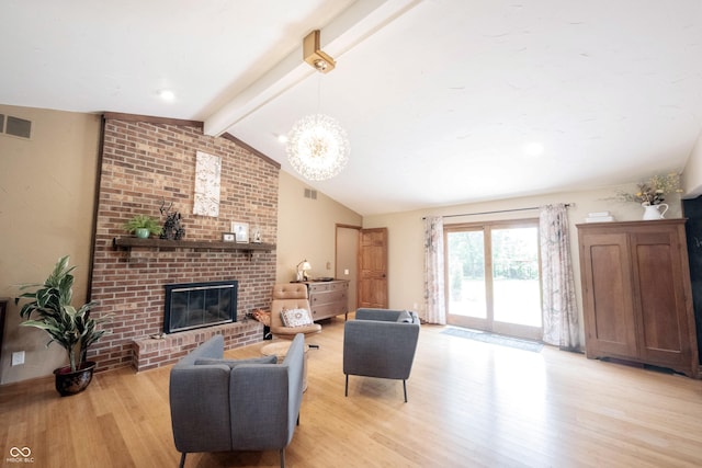 3711 Tara Ct, Carmel, IN 46074 - living room featuring light wood-style flooring, a fireplace, and a chandelier
