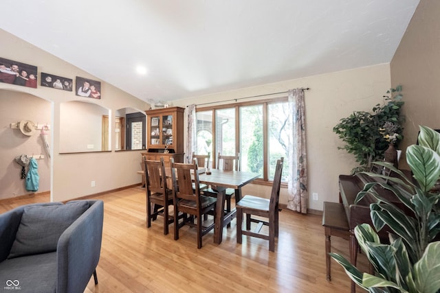 3711 Tara Ct, Carmel, IN 46074 - dining area featuring light wood-type flooring and vaulted ceiling