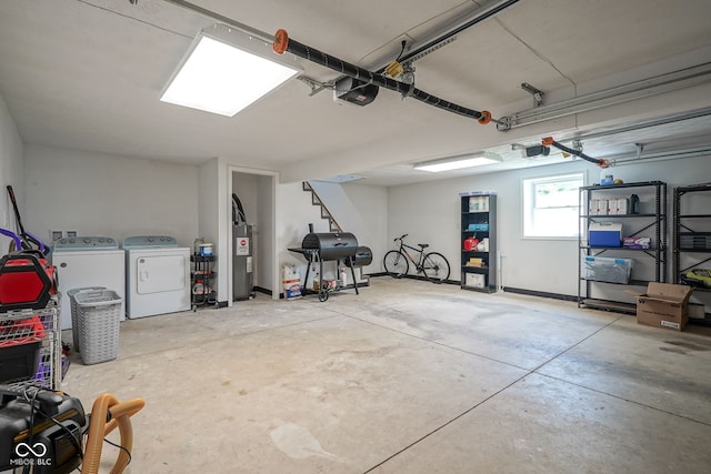 5902 Oak Ln, Anderson, IN 46013 - garage featuring independent washer and dryer, a garage door opener, and electric water heater