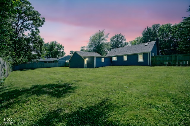 5902 Oak Ln, Anderson, IN 46013 - back of property at dusk with a fenced backyard