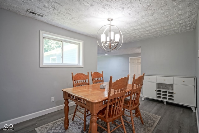 5902 Oak Ln, Anderson, IN 46013 - dining area with a chandelier, wood finished floors, and a textured ceiling