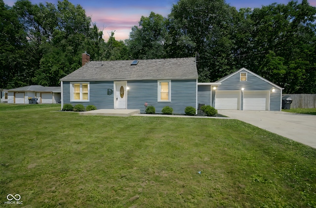5902 Oak Ln, Anderson, IN 46013 - view of front of property with a yard, a chimney, and concrete driveway