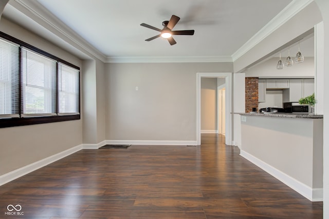 4155 Graceland Ave, Indianapolis, IN 46208 - unfurnished living room featuring a ceiling fan, dark wood-style floors, and crown molding