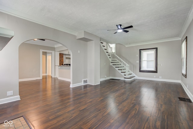 4155 Graceland Ave, Indianapolis, IN 46208 - unfurnished living room with arched walkways, ceiling fan, wood finished floors, a textured ceiling, and stairway