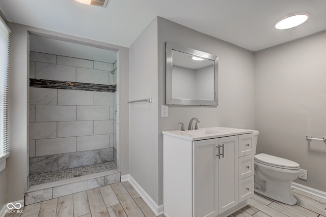4155 Graceland Ave, Indianapolis, IN 46208 - bathroom featuring wood finish floors, a walk in shower, and vanity