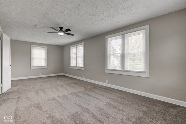 4155 Graceland Ave, Indianapolis, IN 46208 - carpeted empty room featuring a textured ceiling and ceiling fan