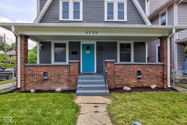 4155 Graceland Ave, Indianapolis, IN 46208 - view of front of home with brick siding and covered porch