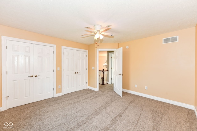 3050 Montgomery Blvd, Lapel, IN 46051 - unfurnished bedroom with multiple closets, carpet floors, and ceiling fan