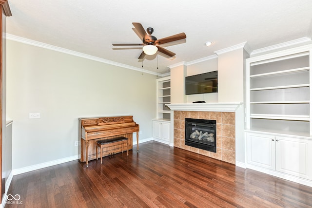 3050 Montgomery Blvd, Lapel, IN 46051 - living area with dark wood-type flooring, a ceiling fan, a tiled fireplace, built in features, and ornamental molding