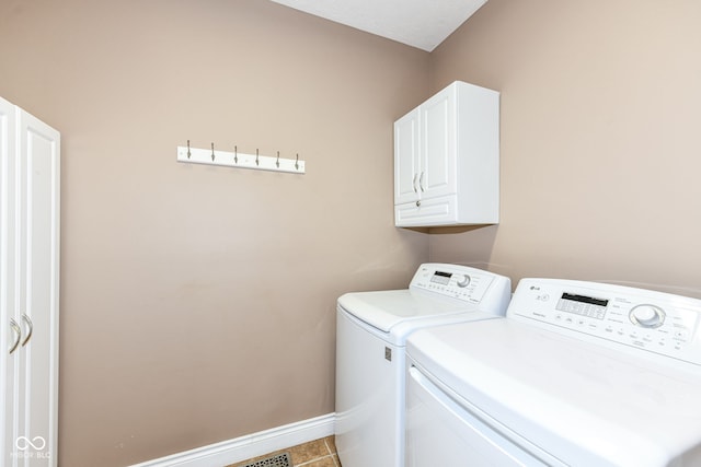 3050 Montgomery Blvd, Lapel, IN 46051 - laundry room featuring independent washer and dryer, cabinet space, and tile patterned flooring