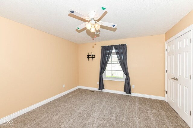 3050 Montgomery Blvd, Lapel, IN 46051 - unfurnished room featuring carpet, ceiling fan, and a textured ceiling