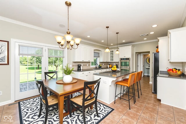 3050 Montgomery Blvd, Lapel, IN 46051 - dining area with light tile patterned floors, recessed lighting, ornamental molding, and a chandelier