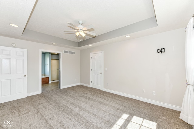 3050 Montgomery Blvd, Lapel, IN 46051 - unfurnished bedroom with carpet, a tray ceiling, recessed lighting, ensuite bath, and a ceiling fan