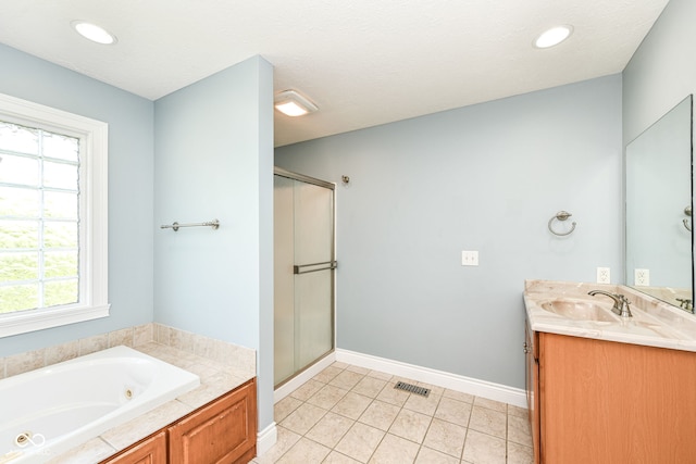 3050 Montgomery Blvd, Lapel, IN 46051 - bathroom featuring a stall shower, a tub with jets, double vanity, and tile patterned flooring