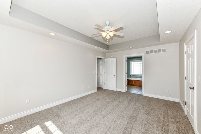 3050 Montgomery Blvd, Lapel, IN 46051 - unfurnished bedroom featuring light colored carpet, a raised ceiling, recessed lighting, a textured ceiling, and ensuite bath