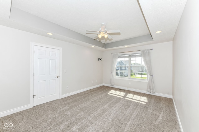 3050 Montgomery Blvd, Lapel, IN 46051 - unfurnished room featuring carpet floors, ceiling fan, recessed lighting, and a tray ceiling