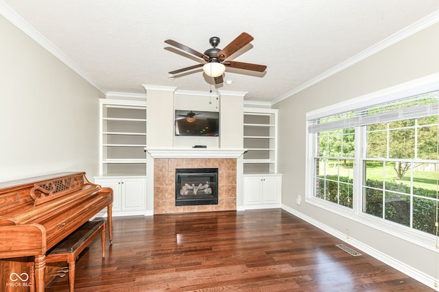 3050 Montgomery Blvd, Lapel, IN 46051 - living area with a ceiling fan, dark wood finished floors, crown molding, and a tile fireplace