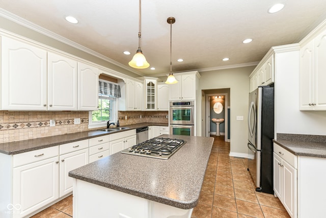 3050 Montgomery Blvd, Lapel, IN 46051 - kitchen with appliances with stainless steel finishes, dark countertops, decorative backsplash, recessed lighting, and white cabinetry