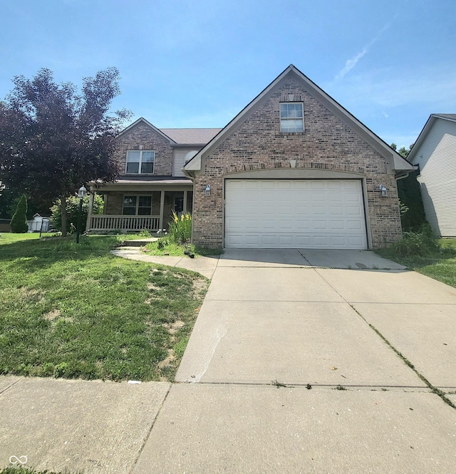 430 N Greenbriar Dr, Greenwood, IN 46142 - traditional-style home with driveway, brick siding, a front yard, and a porch
