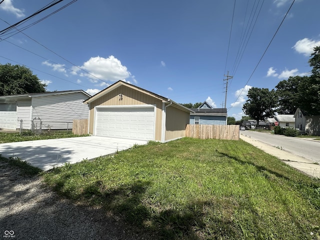 1256 Kappes St, Indianapolis, IN 46221 - view of home's exterior featuring a detached garage and an outdoor structure